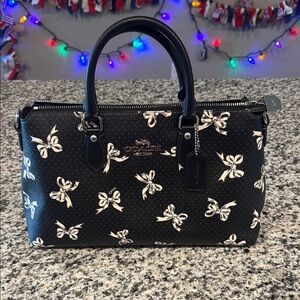 Coach Black Satchel with white bows and gray dots.